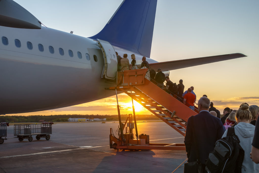 passengers boarding an airplane