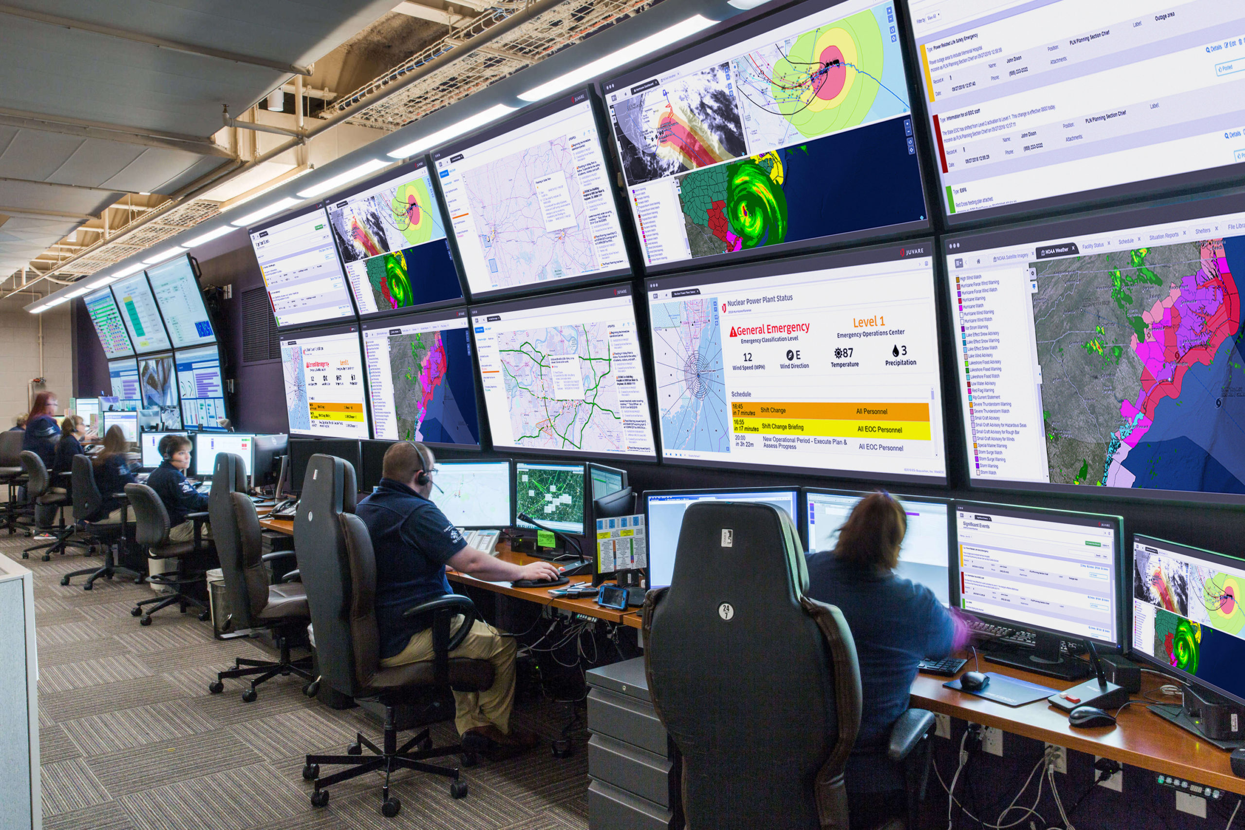 eoc emergency operations center with webeoc screenshots on monitors