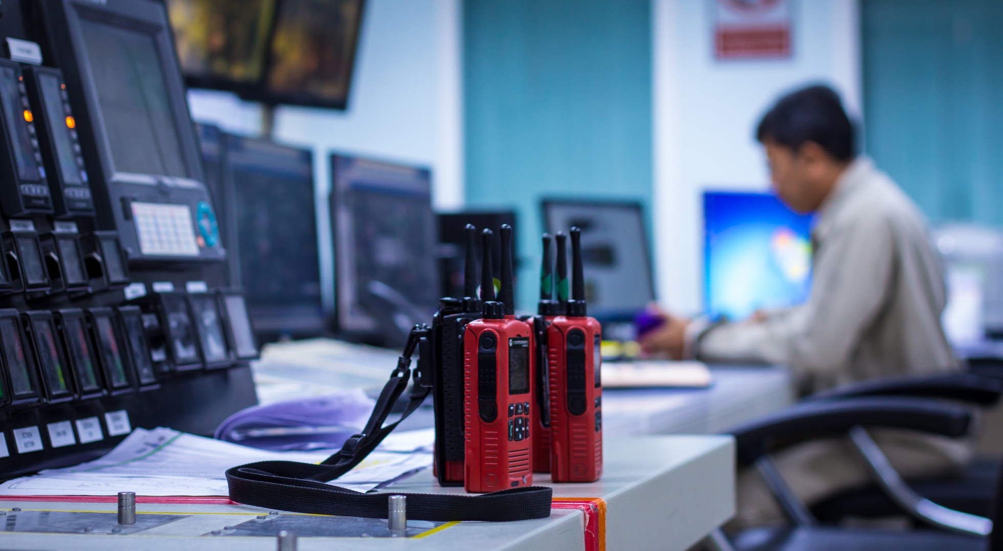 emergency response center with handheld radios in foreground