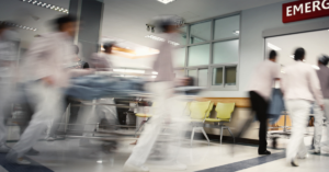 healthcare workers rushing patient into emergency room