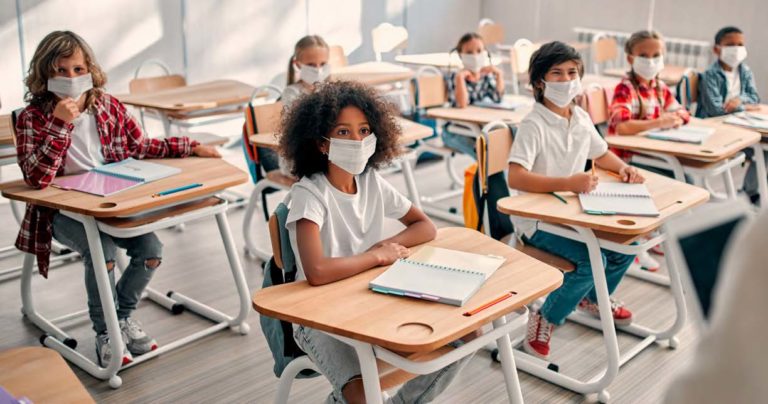 kids in classroom wearing masks because of covid-19 pandemic