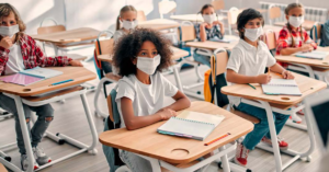 primary school children wearing masks in classroom