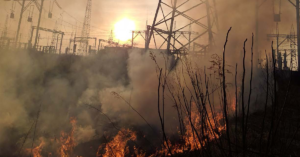 wildfire and smoke at an electric company substation