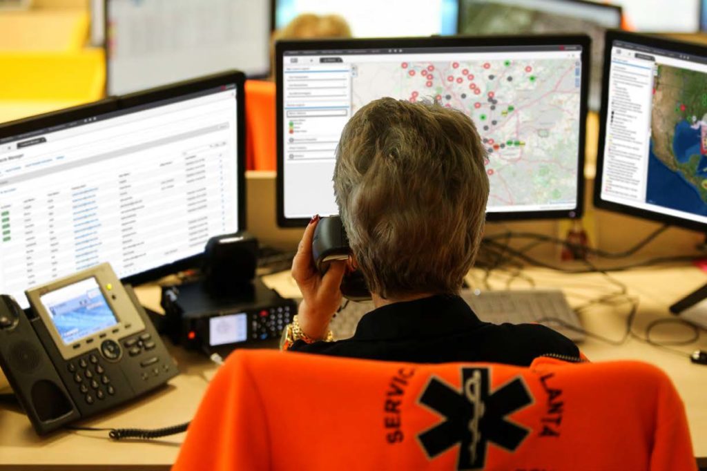 emergency management professional using webeoc in an eoc