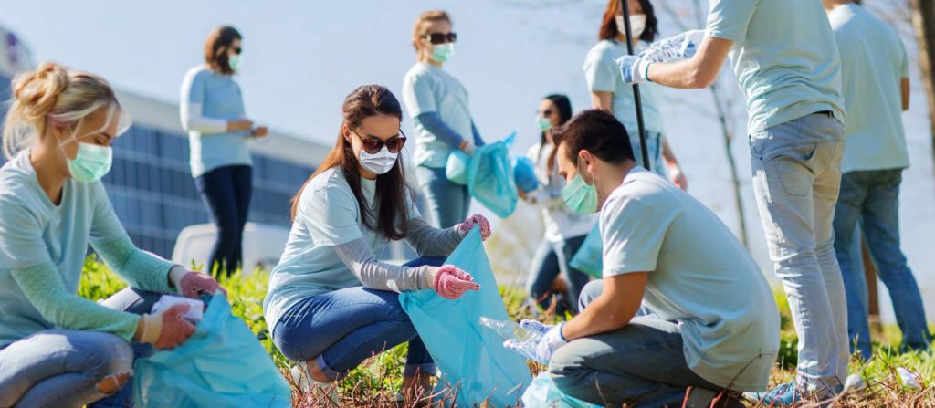 volunteers working and picking up trash